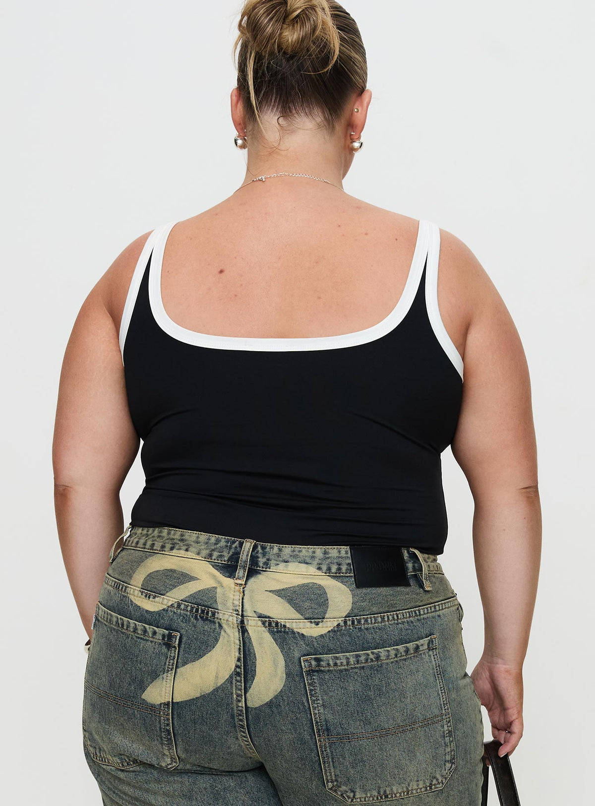 back view of model wearing Princess Polly Astrea Bodysuit Black / White Curve Sleeveless Bodysuit 