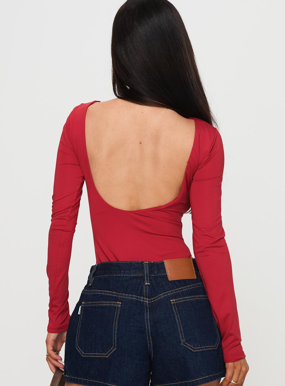 back view of model wearing Princess Polly Beresford Long Sleeve Bodysuit Wine Long Sleeve Tops Bodysuit 