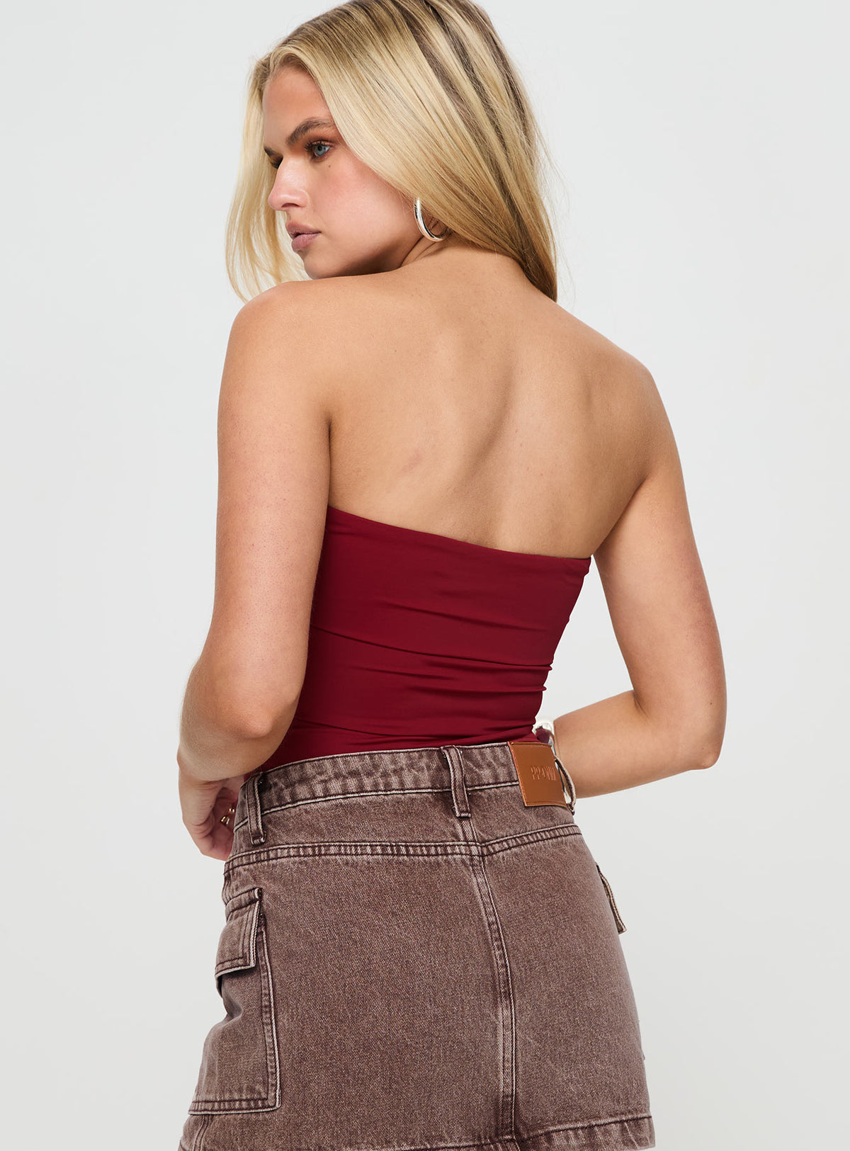 back view of model wearing Princess Polly Niner Strapless Bodysuit Burgundy Sleeveless Bodysuit 