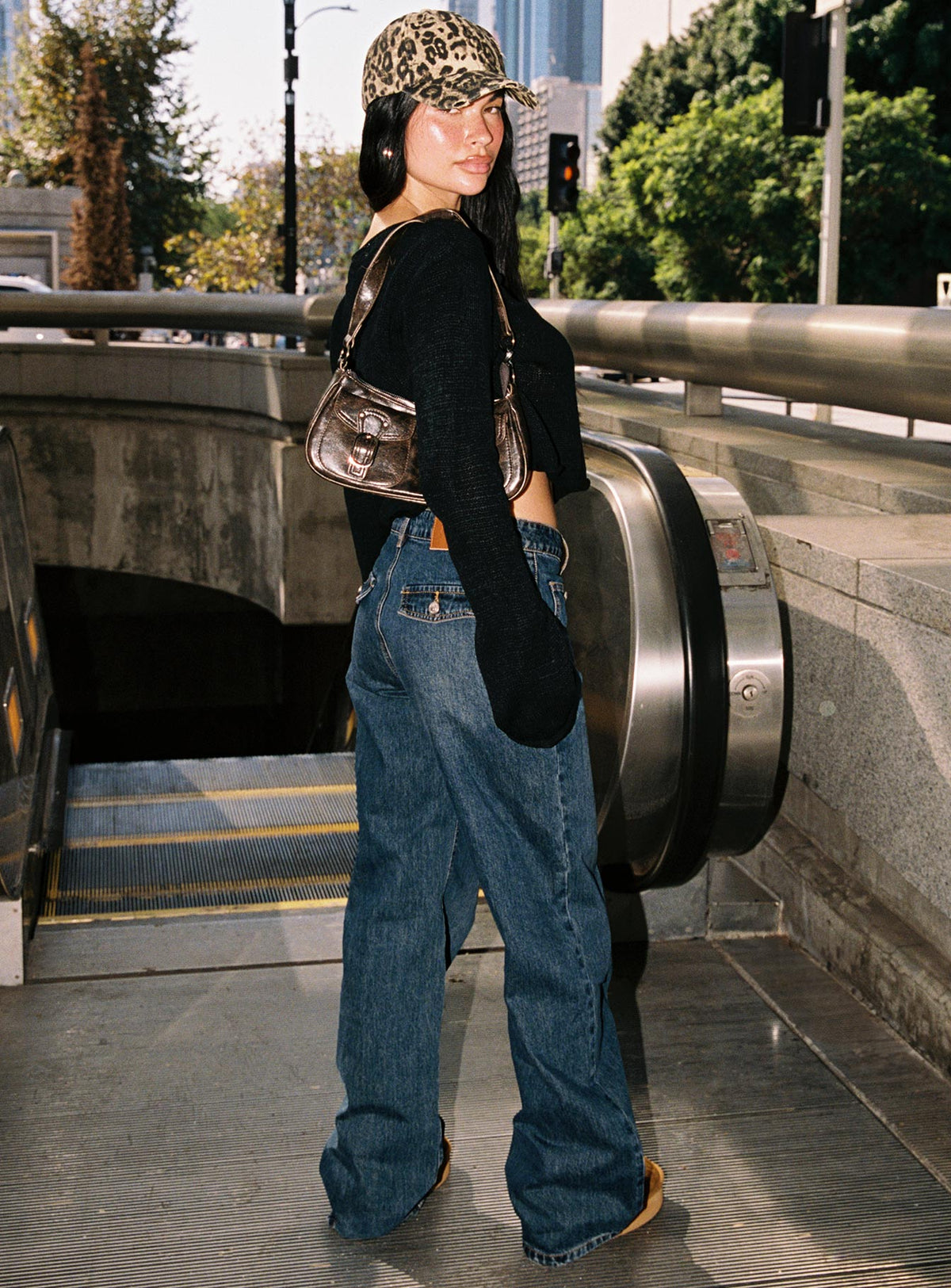 back view of model wearing Princess Polly Carianne Low Rise Wide Leg Jeans Dark Wash High Rise Jeans Jeans 