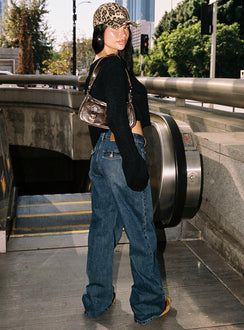 back view of model wearing Princess Polly Carianne Low Rise Wide Leg Jeans Dark Wash High Rise Jeans Jeans 