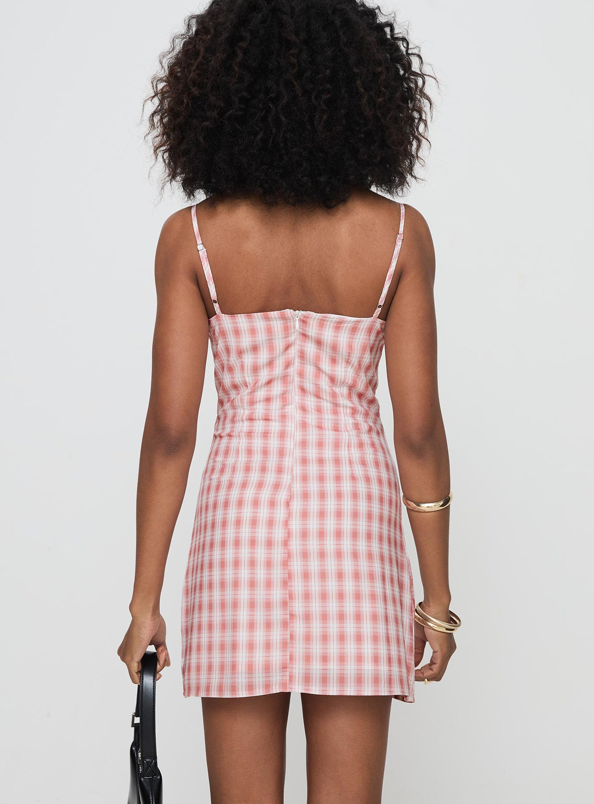 back view of model wearing Princess Polly Poto Mini Dress Pink Check Sweetheart Neckline 