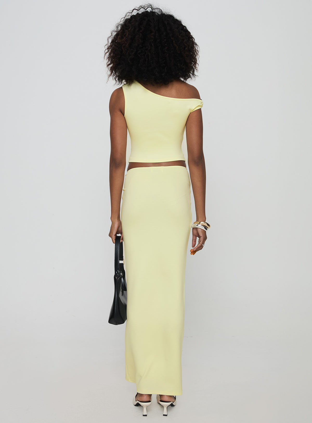 back view of model wearing Princess Polly Whiley Maxi Skirt Cream Maxi Skirts Skirts 