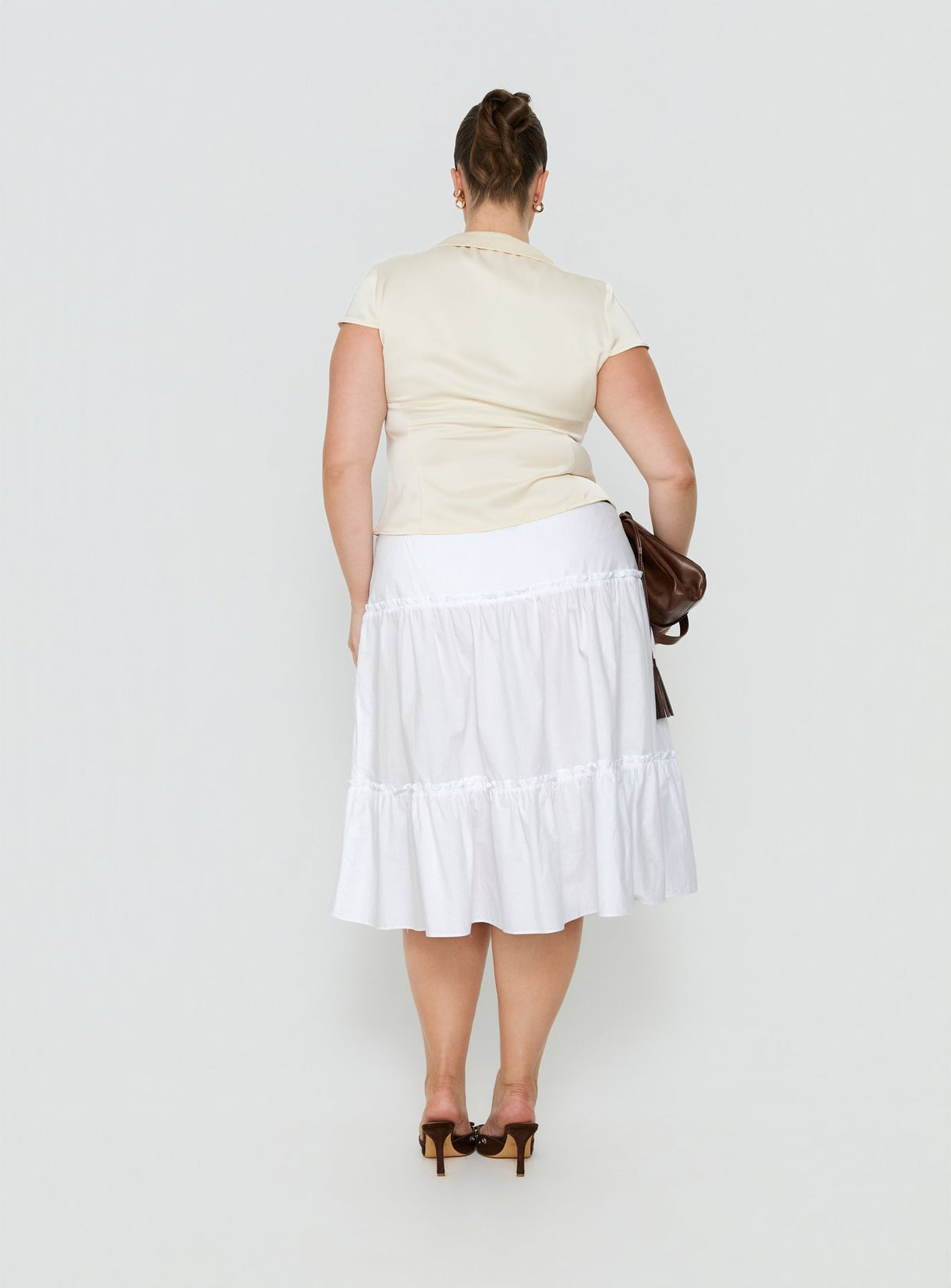 Presenting the Cascades Low Rise Midi Skirt White Curve in womens-skirts with midi length back view of model wearing