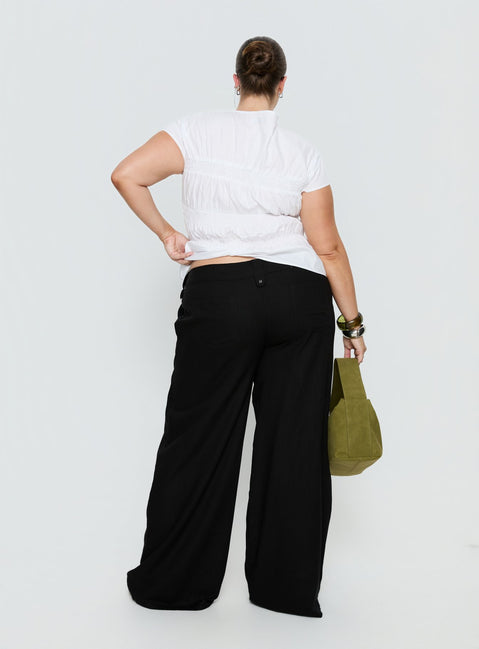 back view of model wearing Princess Polly Pedra Wide Leg Pant Black Curve Mid Rise Pants Pants 