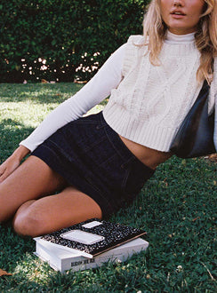   side view of model wearing Princess Polly Hughes Mini Skirt Dark Wash Denim Petite Mini Skirts Skirts 