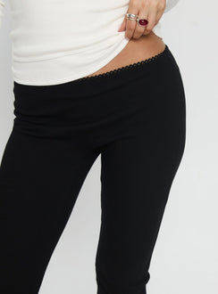 back view of model wearing Princess Polly Baseline Rib Capri Pants Black Tall Mid Rise Pants Pants 