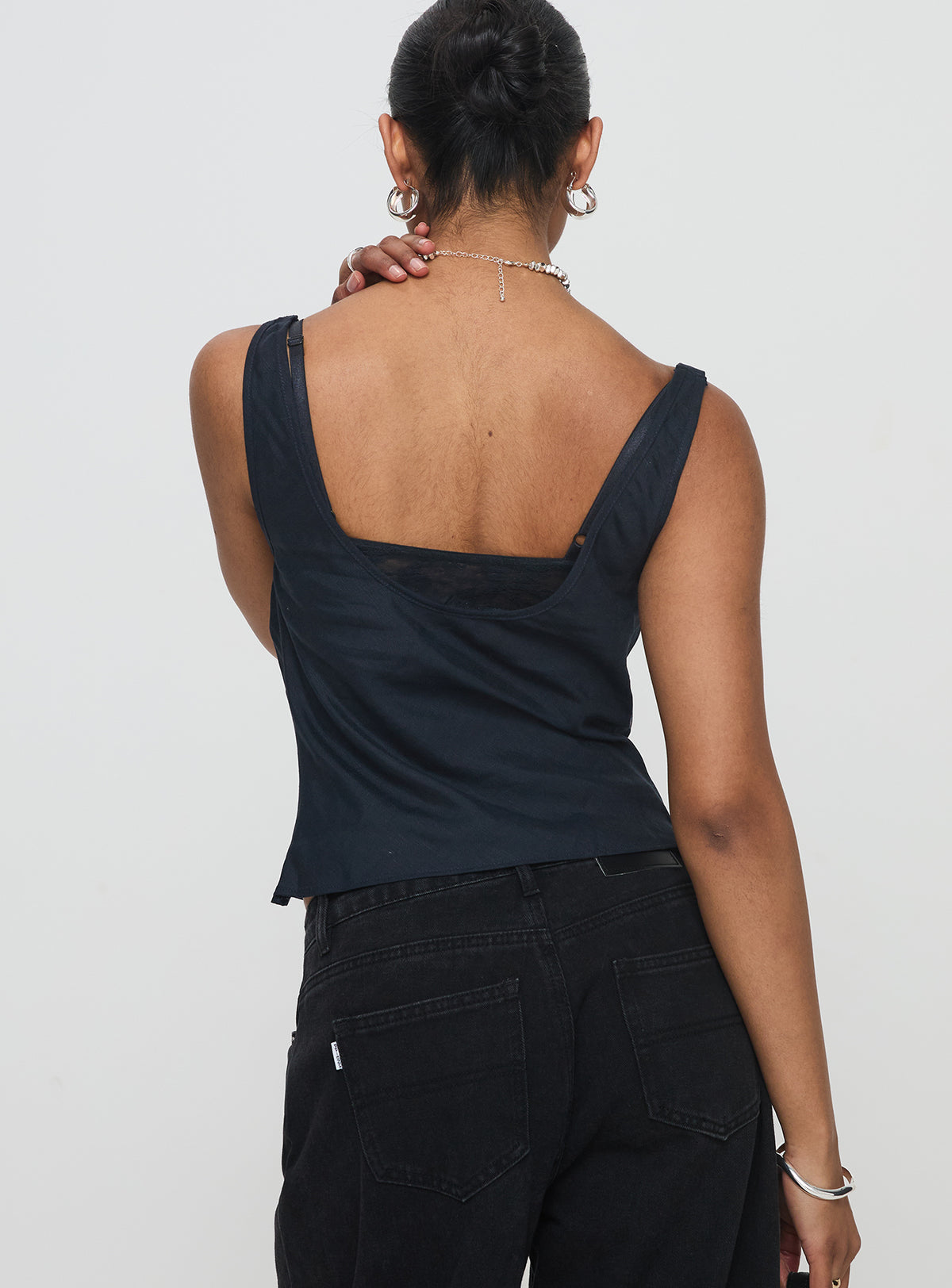 back view of model wearing Princess Polly Delilah Top Navy Sleeveless Cowl 