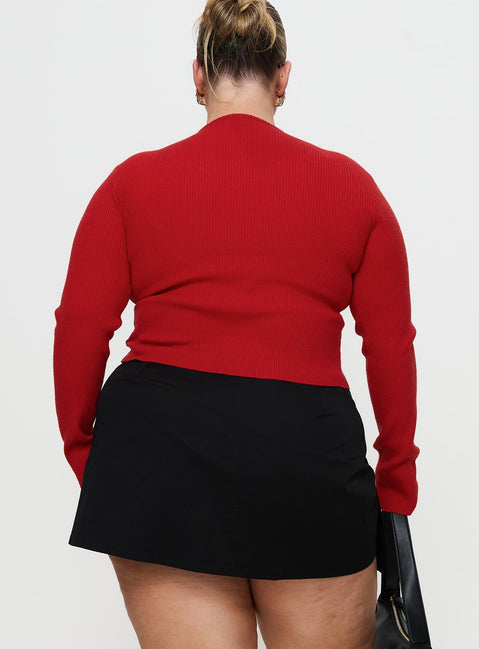 back view of model wearing Princess Polly Sora Skort Black Curve High Waisted Shorts 