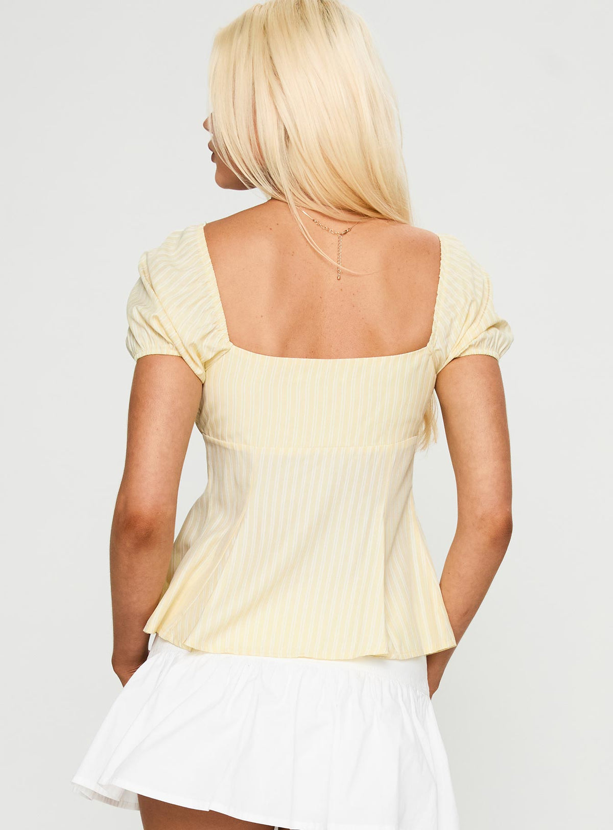 back view of model wearing Princess Polly How To Fly Tie Detail Top Yellow Short Sleeves Square Neck 