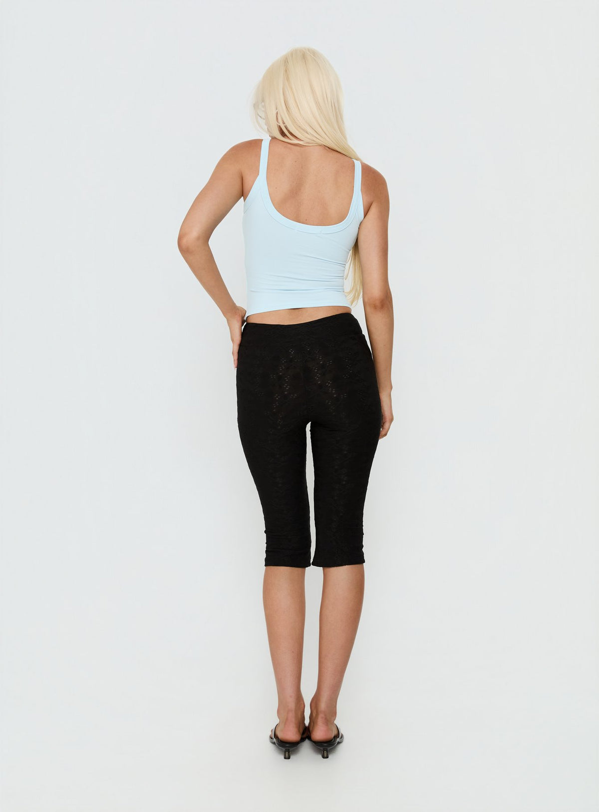 Explore the Samaira Capri Pant Black Anglaise womens-regular-pants designed with high-rise back view of model wearing Princess Polly