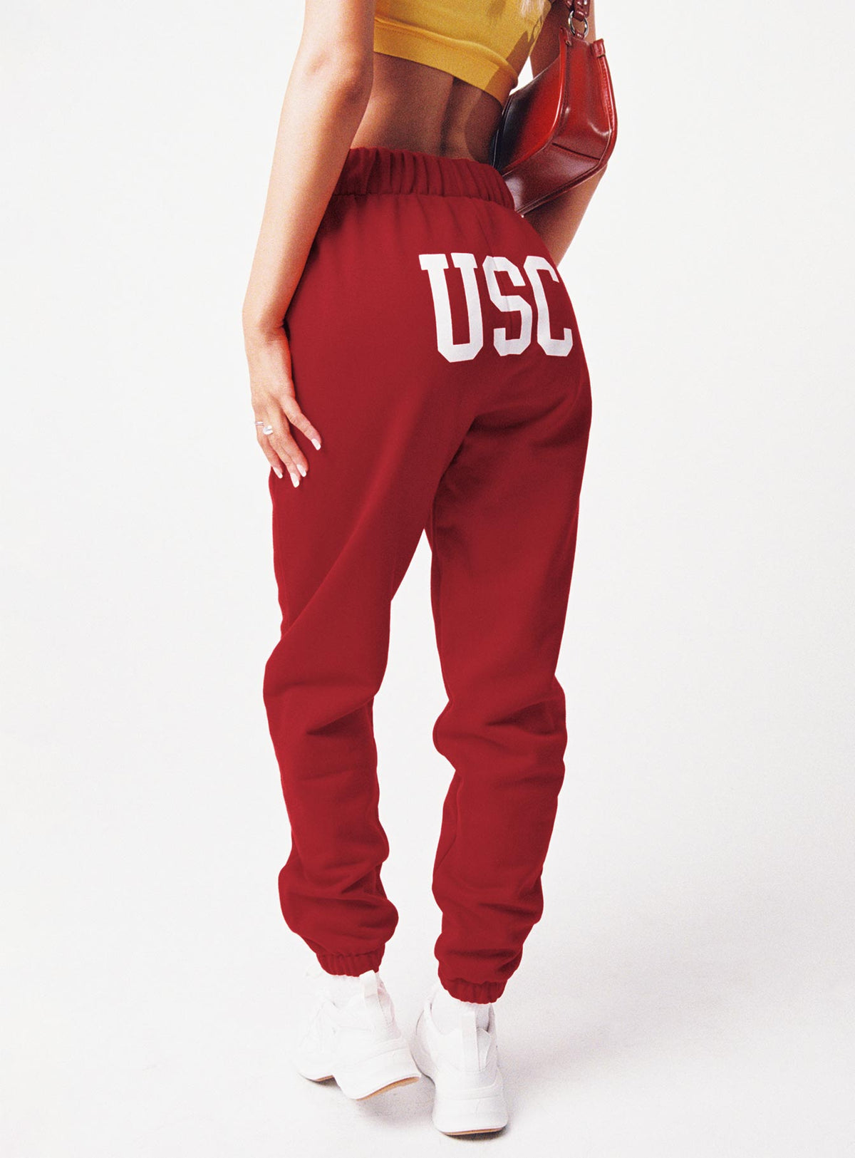 back view of model wearing Princess Polly USC Sweatpants Cardinal Red / White Pants 