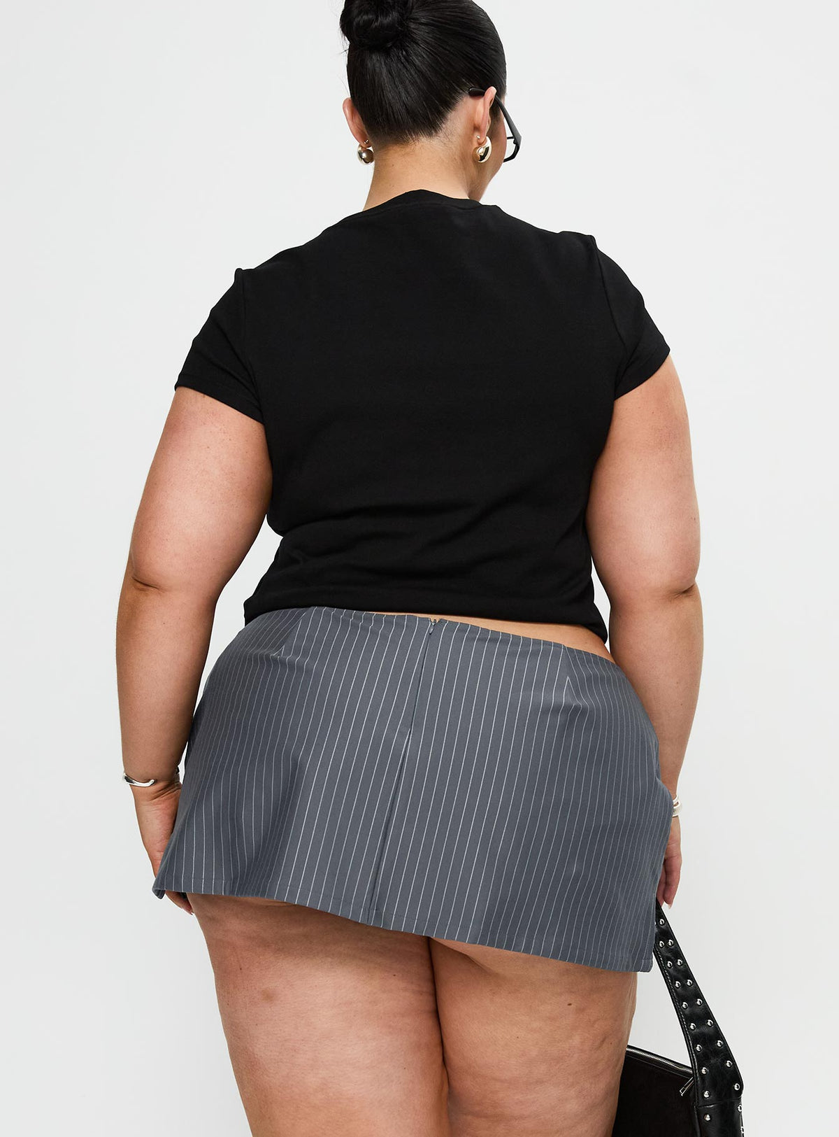 back view of model wearing Princess Polly Can't Sleep Skort Charcoal Stripe Curve High Waisted Shorts 