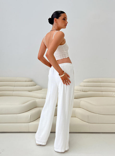 side view of model wearing Princess Polly Parklea Pants White Tall Pants 