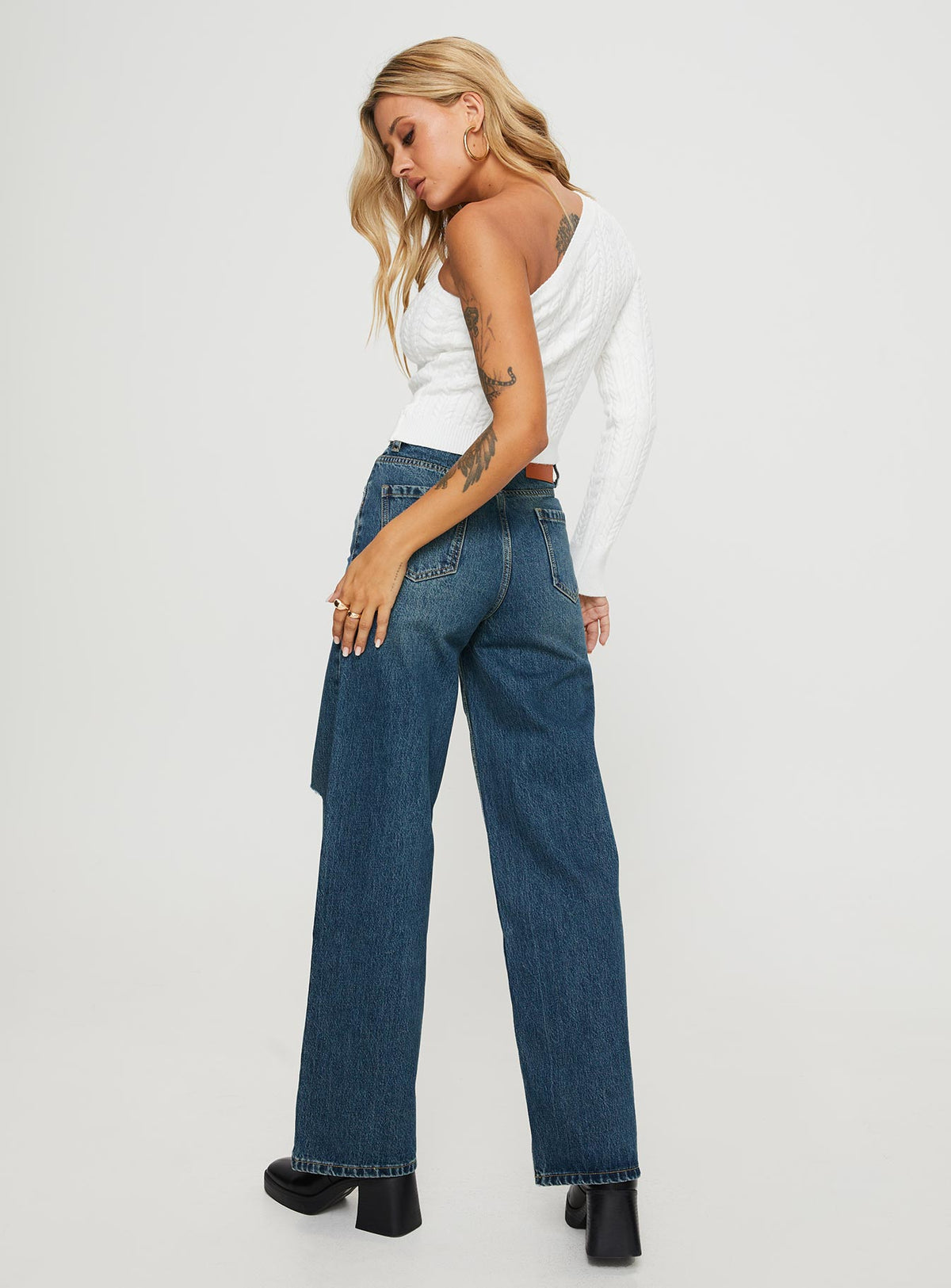back view of model wearing Princess Polly Beetle High Rise Wide Leg Ripped Jeans Mid Wash Mid Rise Jeans Jeans 