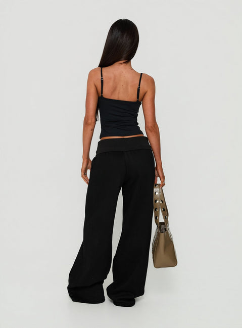Introducing the Lockie Foldover Baggy Track Pants Black womens-regular-pants in high-rise back view of model wearing
