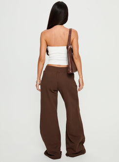 back view of model wearing Princess Polly Summits Flared Track Pants Chocolate High Rise Pants Pants 