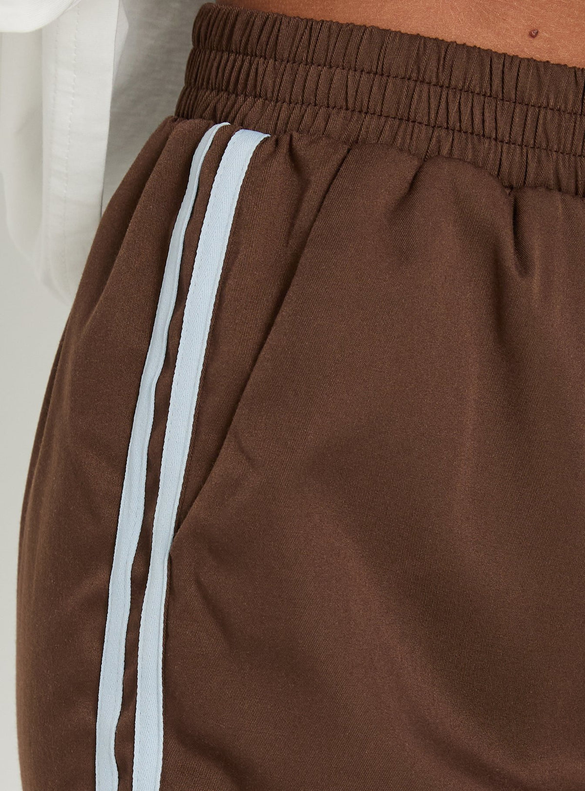 Crafted with high-rise design, the Fielder Track Pants Brown / Blue womens-regular-pants product Princess Polly