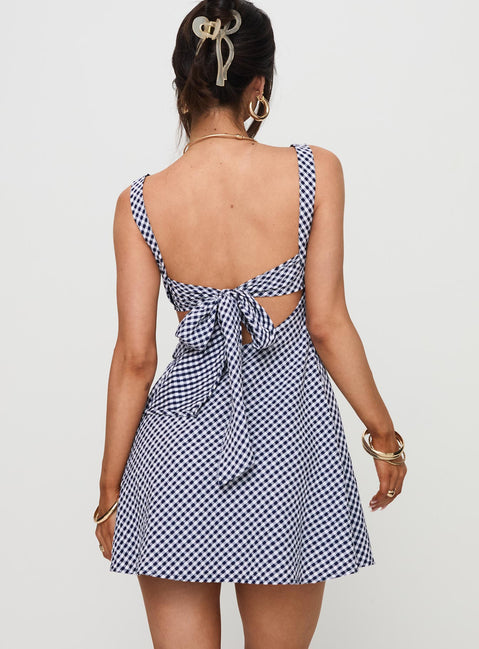 back view of model wearing Princess Polly Mcbeath Mini Dress Navy Check Sweetheart Neckline 