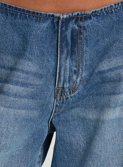 Highlighting the Roamer No Waist Low Rise Super Baggy Vintage Mid Blue womens jeans with low-rise waist and stitching detail Princess Polly