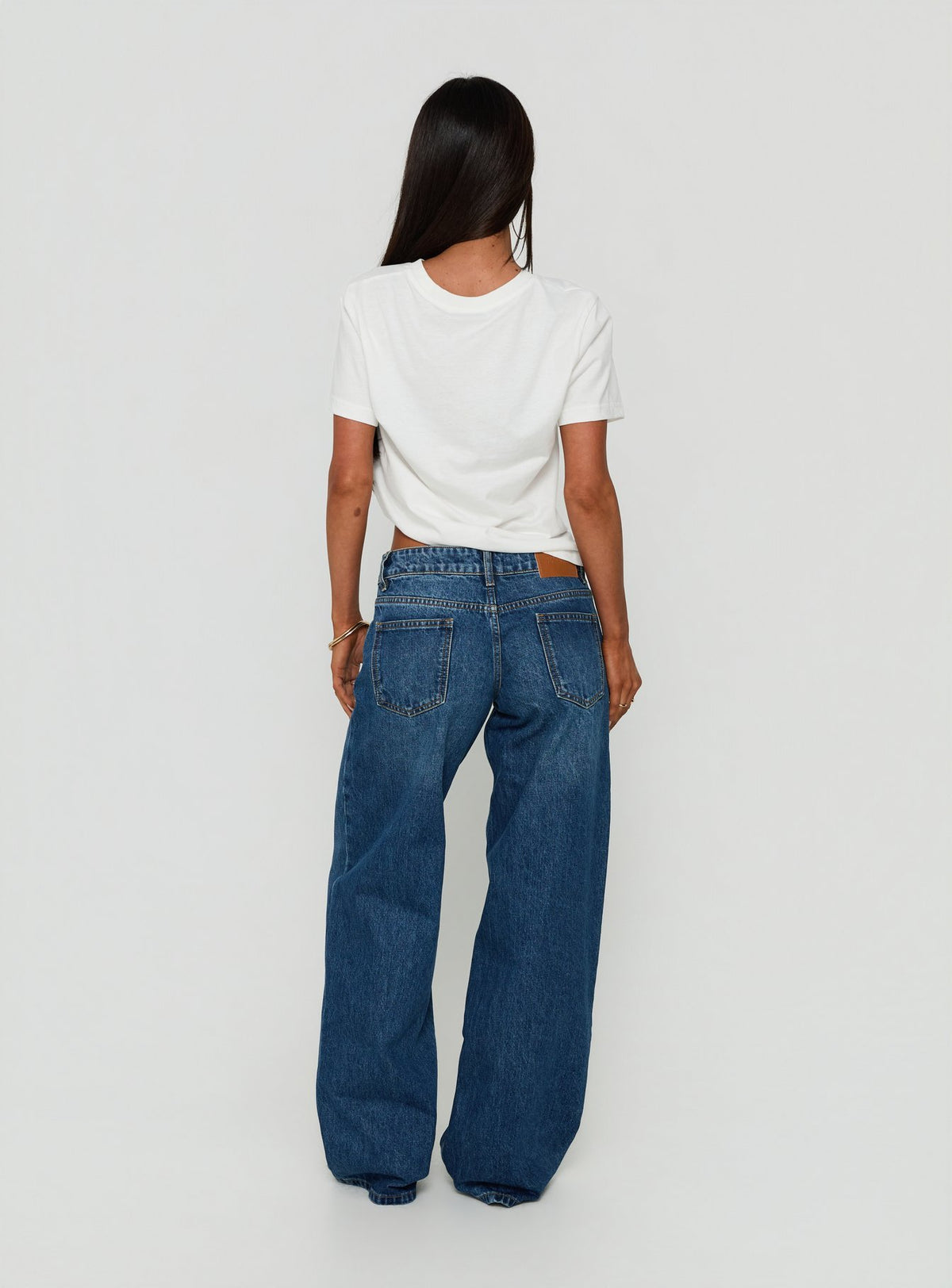 Presenting the Ellanor Low Rise Straight Leg Jeans Vintage Dark Blue in womens-jeans with low-rise waist back view of model wearing Princess Polly