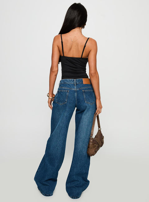 back view of model wearing Princess Polly Duster Mid Rise Baggy Jeans Dark Wash Mid Rise Jeans Jeans 