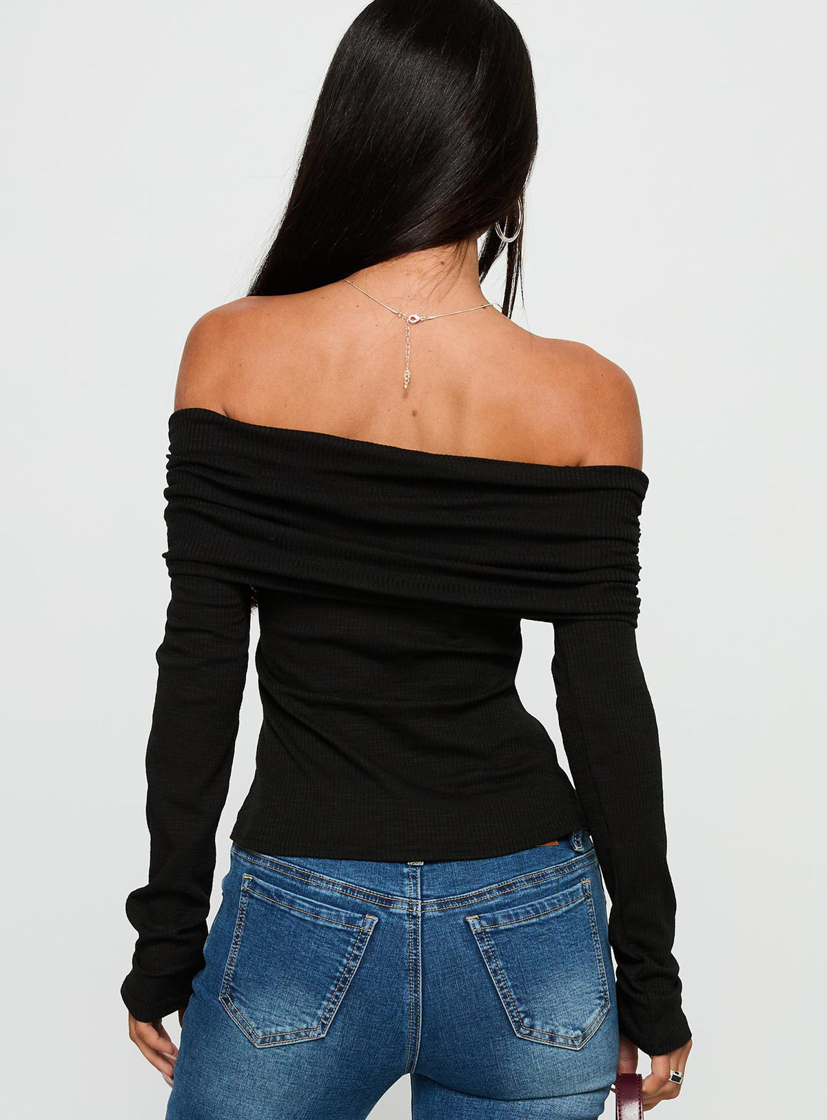 back view of model wearing Princess Polly Victorea Off Shoulder Top Black Full Sleeves straight 