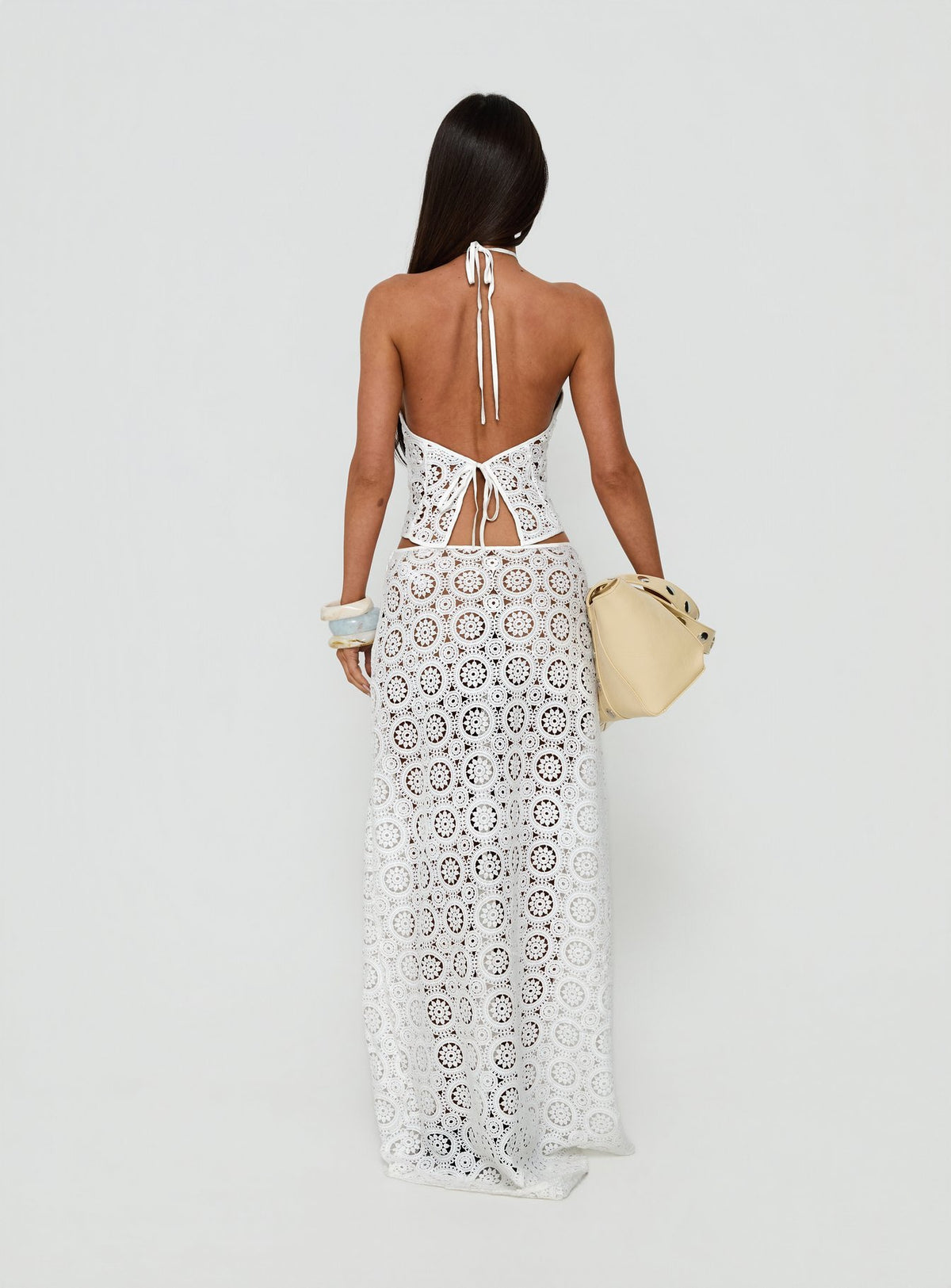 Showcasing the Starting Fresh Crochet Maxi Skirt White womens-skirts with fitted aline cut back view of model wearing