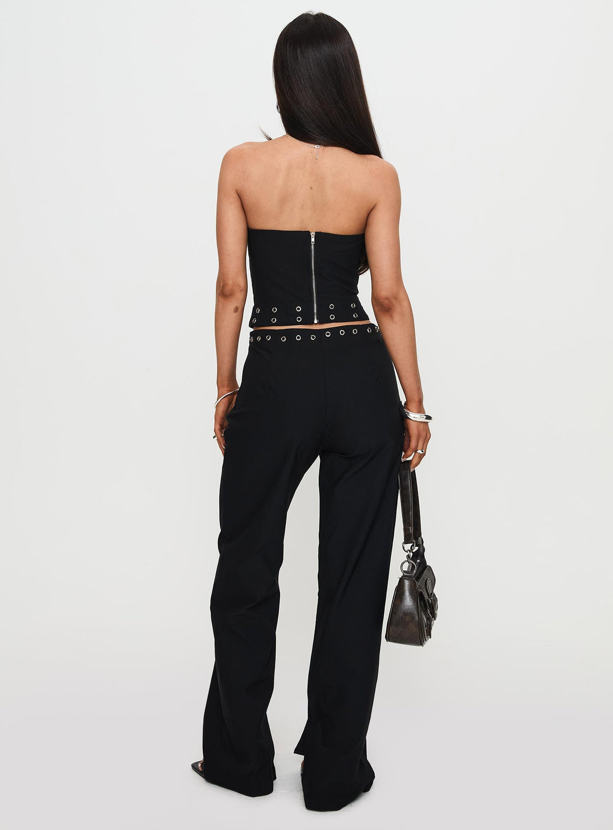 back view of model wearing Princess Polly Passionette Pants Black Petite High Rise Pants Pants 