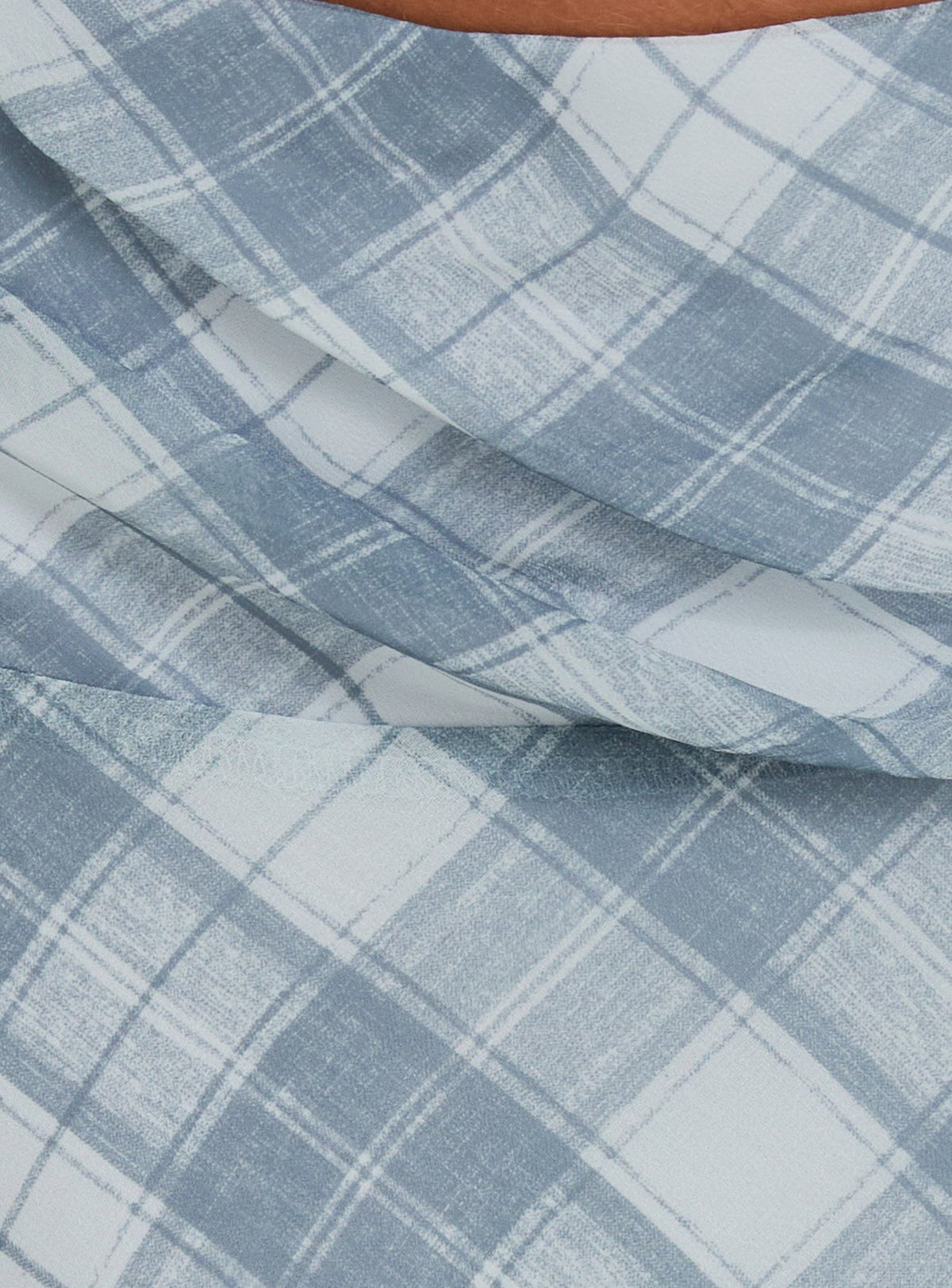Close-up of Sabbine Asymmetrical Midi Skirt Blue Check womens-skirts highlighting midi length Princess Polly