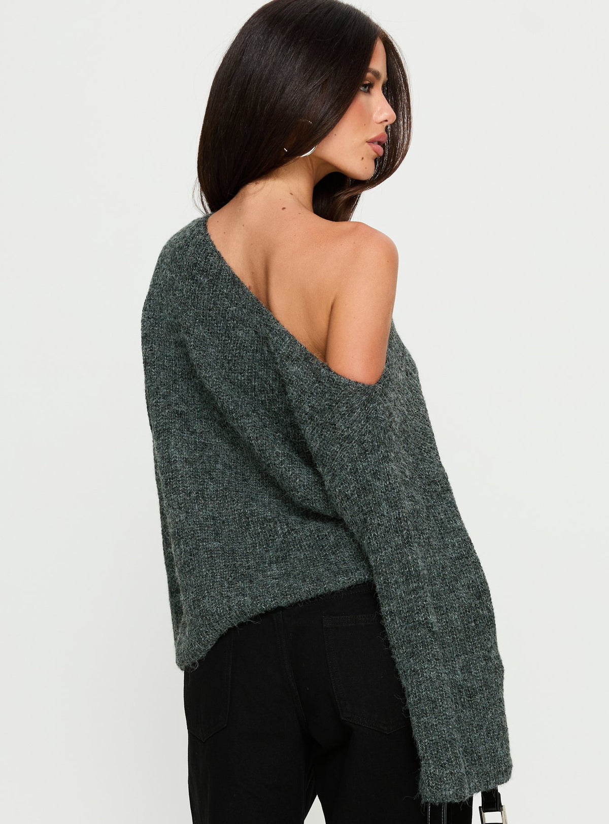 Highlighting the Delyn Off Shoulder Slouchy Knit Sweater in Black Marle, a womens jumper with short length back view of model wearing Princess Polly