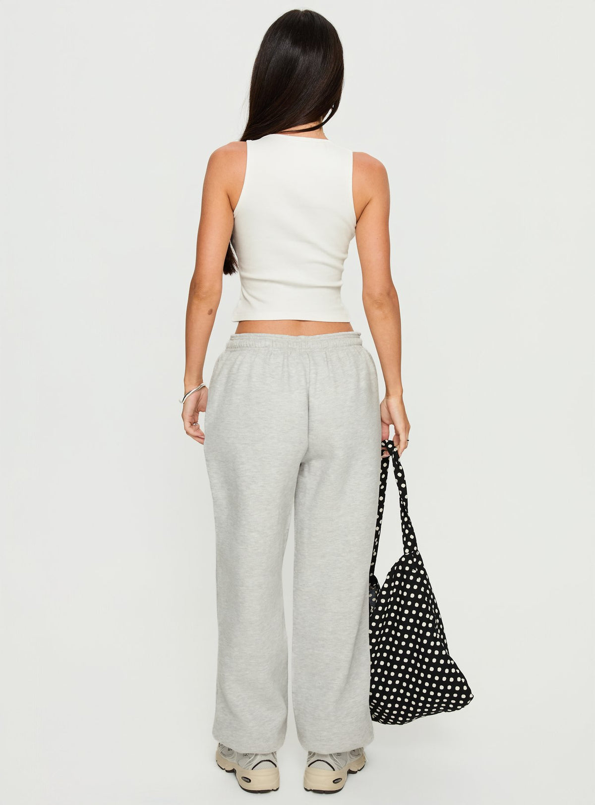 back view of model wearing Princess Polly Caspa Dream Fleece Oversized Ankle Cuff Jogger Grey Marle High Rise Pants Pants 