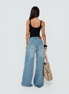 Displaying the Naylor Mid Rise Wide Leg Jeans Light Wash Denim Tall in womens-jeans with mid-rise back view of model wearing Princess Polly