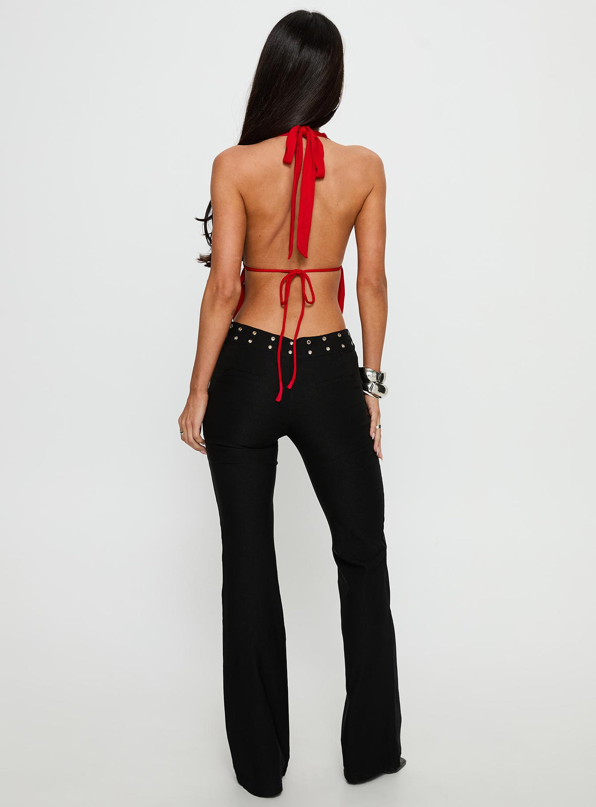 back view of model wearing Princess Polly Yevina Eyelet Flare Pant Black Low Rise Pants Pants 