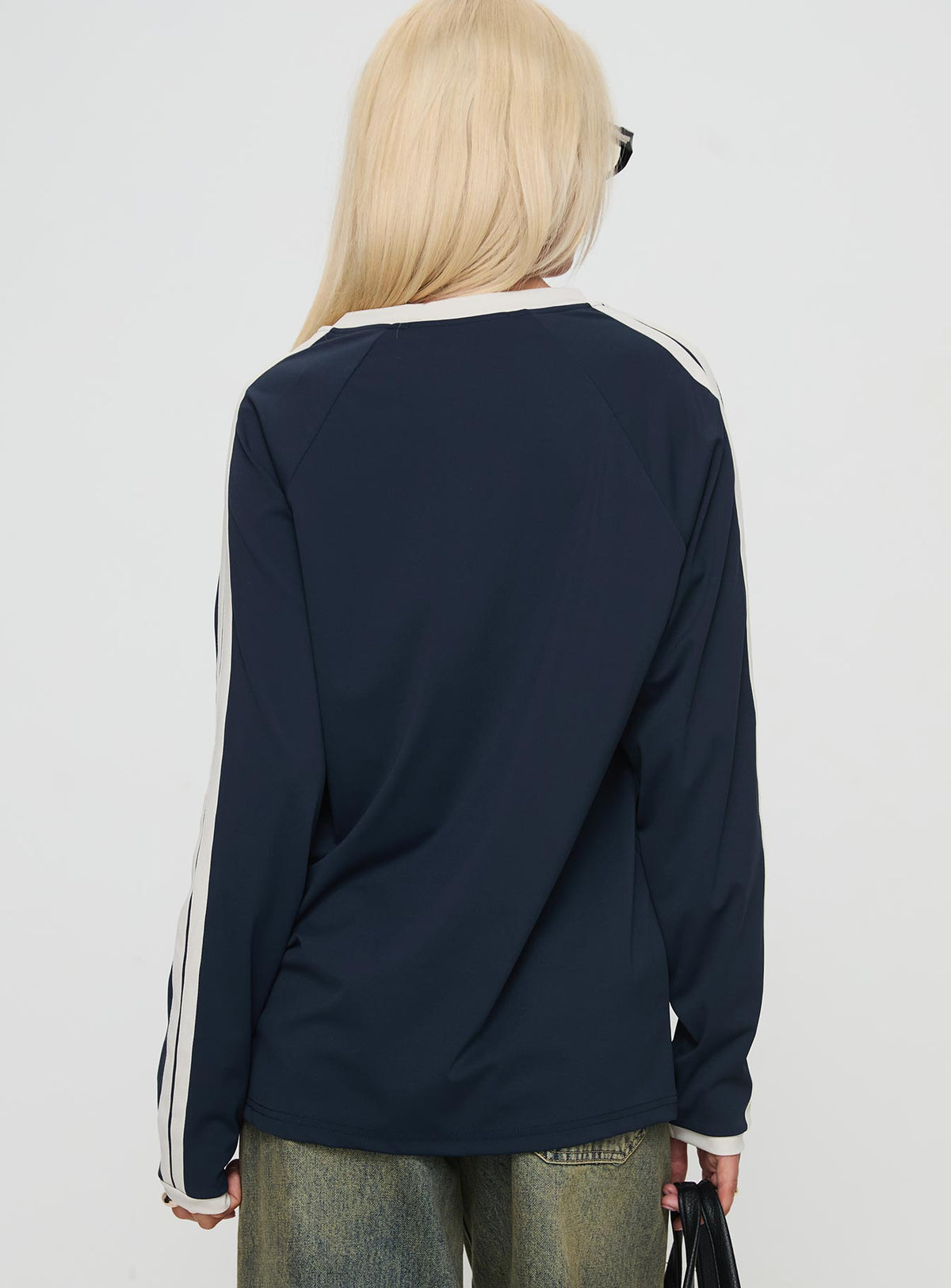 back view of model wearing Princess Polly Spectate Top Long Sleeve Navy Full Sleeves V-Neck 