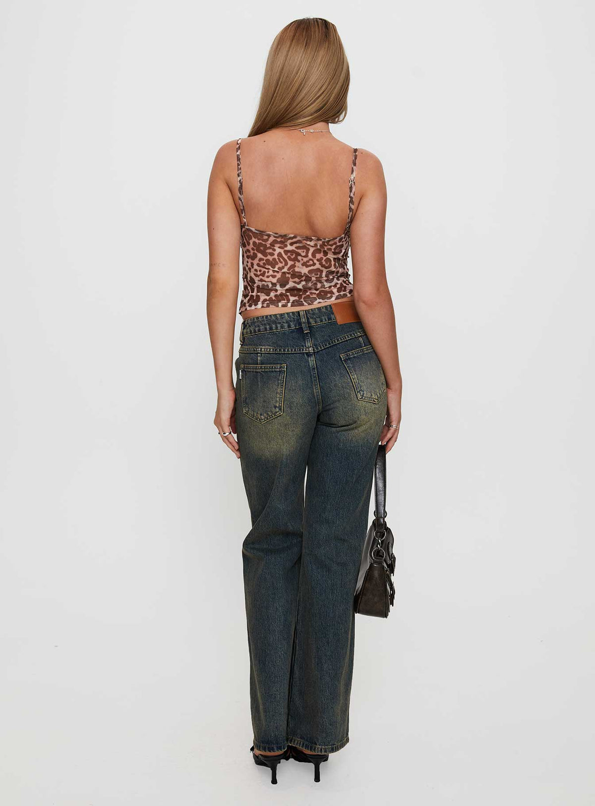 back view of model wearing Princess Polly Inverness Pinched Detail Mid Rise Wide Leg Jeans Tea Mid Rise Jeans Jeans 