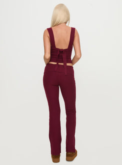 back view of model wearing Princess Polly Closed Eyes Flared Pants Maroon Low Rise Pants Pants 