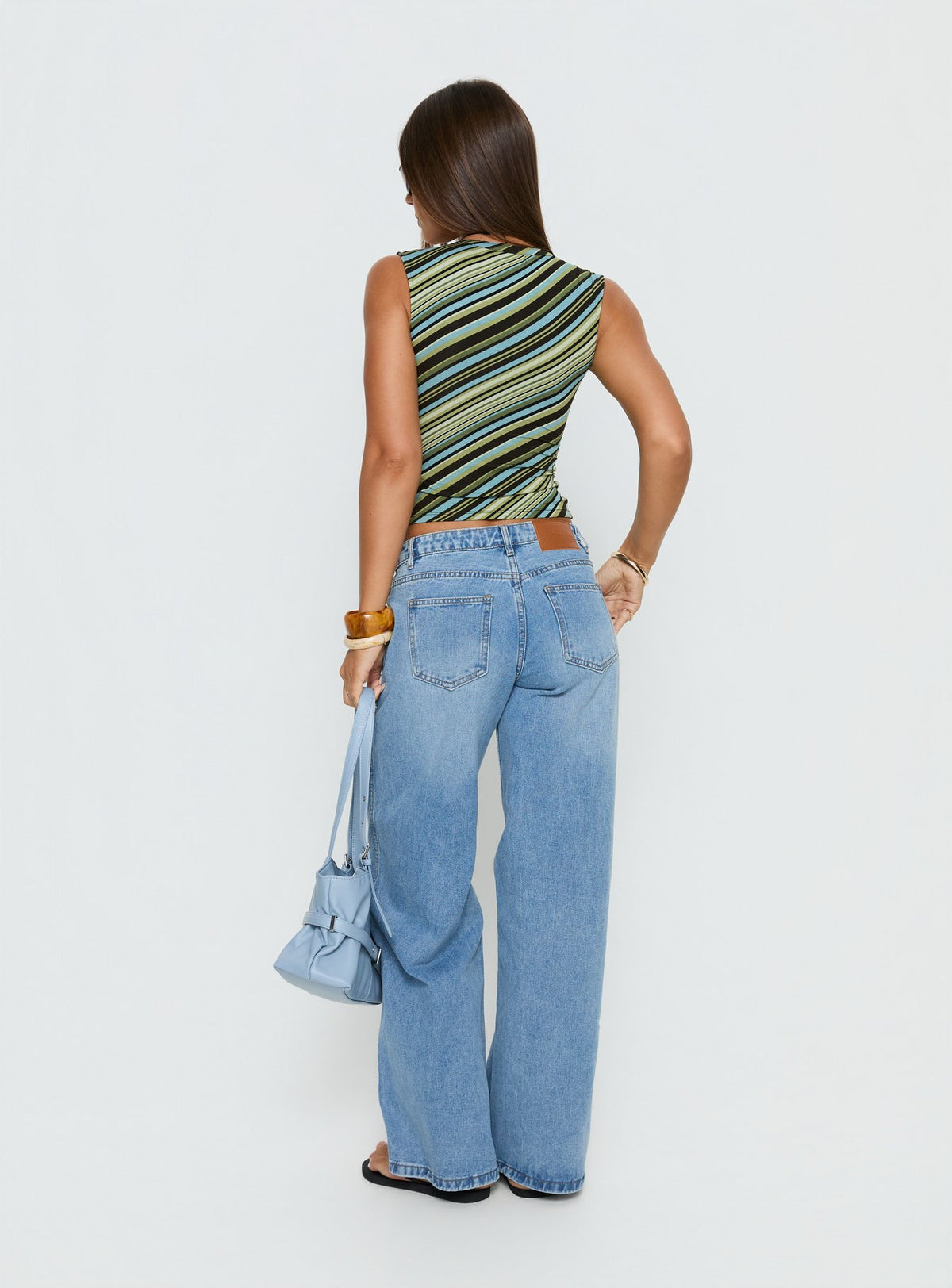 Presenting the Ramos Low Rise Denim Jeans Bright Blue Wash Petite in womens-jeans with low-rise waist back view of model wearing