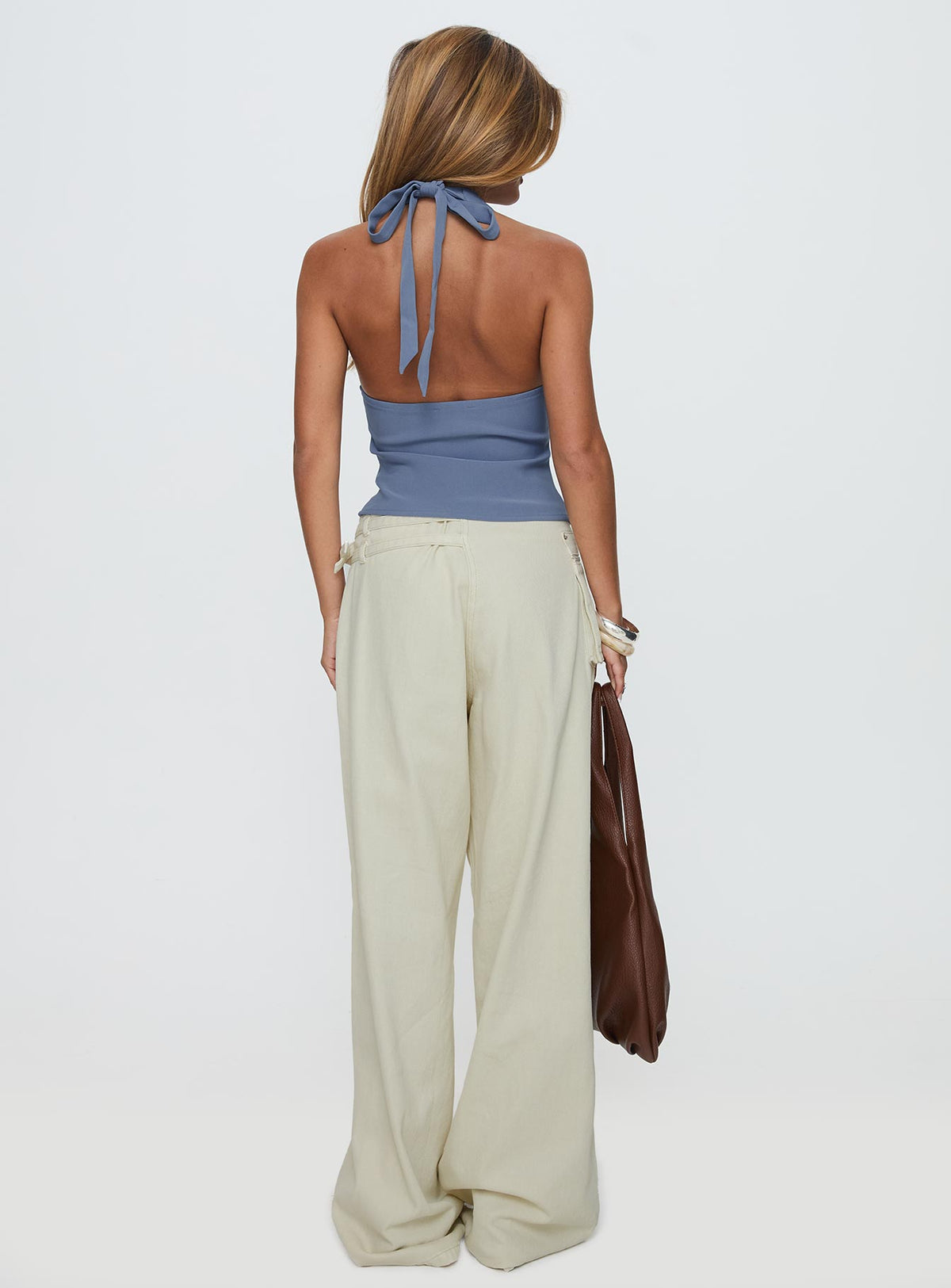 back view of model wearing Princess Polly Paltrow Cargo Jeans Cream Low Rise Jeans 