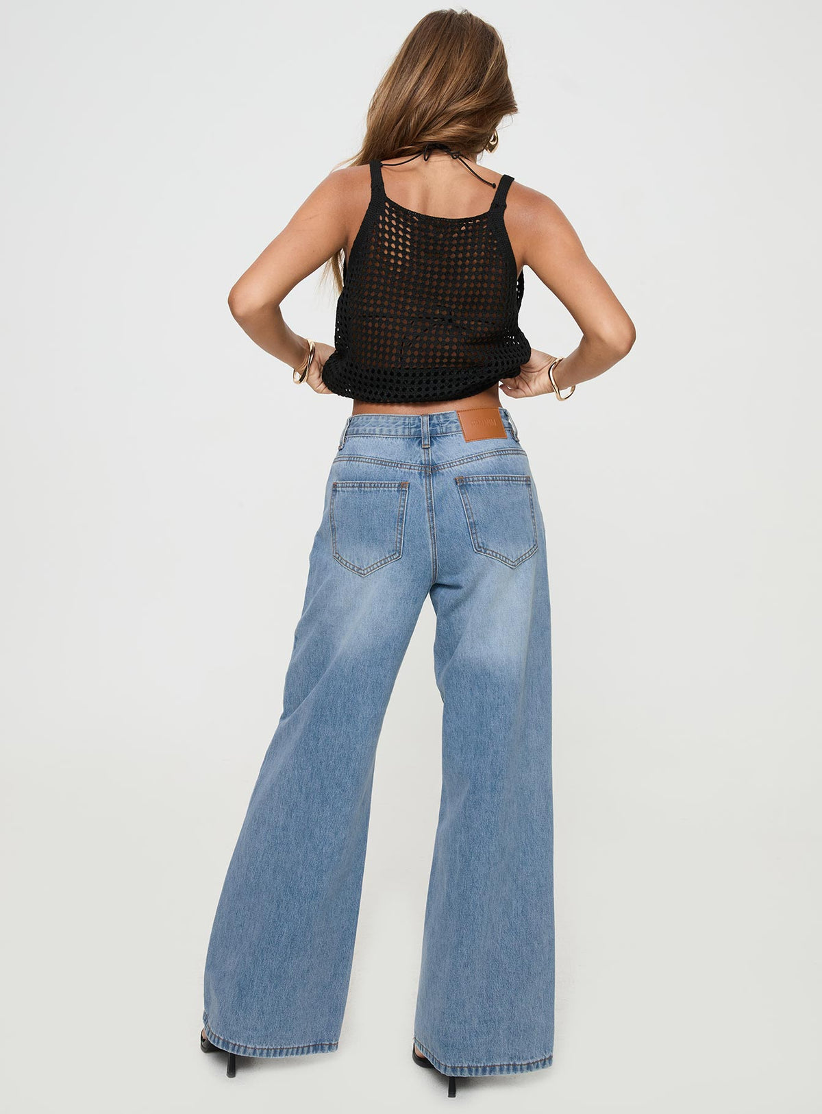 back view of model wearing Princess Polly Colemane Mid Rise Flared Jeans Angel Blue High Rise Jeans Jeans 