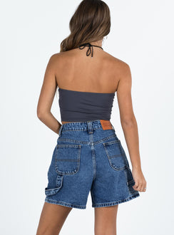 back view of model wearing Princess Polly Lou Carpenter Denim Shorts Mid Wash Petite High Waisted Shorts 