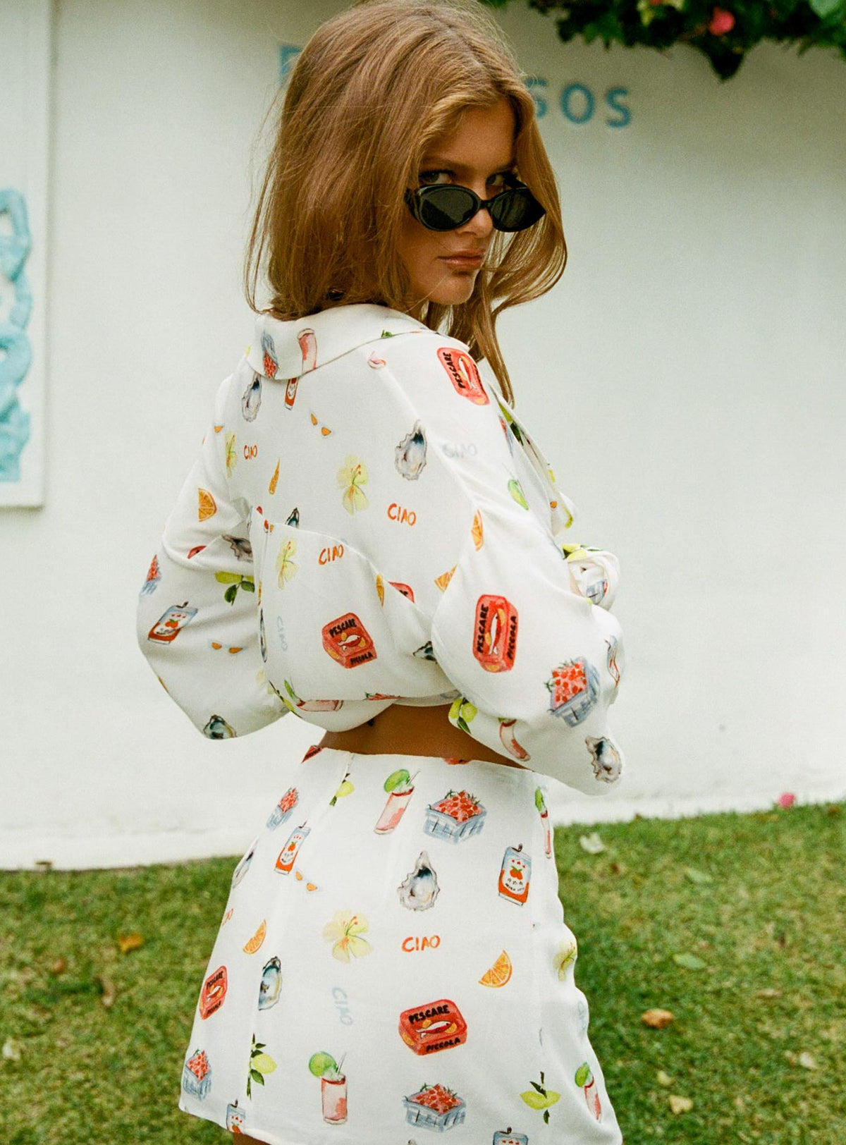 back view of model wearing Princess Polly Caraliia Shirt White / Multi Three Fourth Sleeves V-Neck 