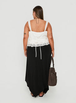 Presenting the Futura Asymmetrical Midi Skirt Black Curve in womens-skirts with midi length back view of model wearing Princess Polly