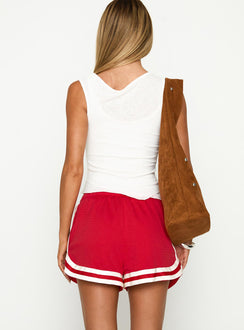 back view of model wearing Princess Polly Ny Trackstar Shorts Red Low Rise Shorts 