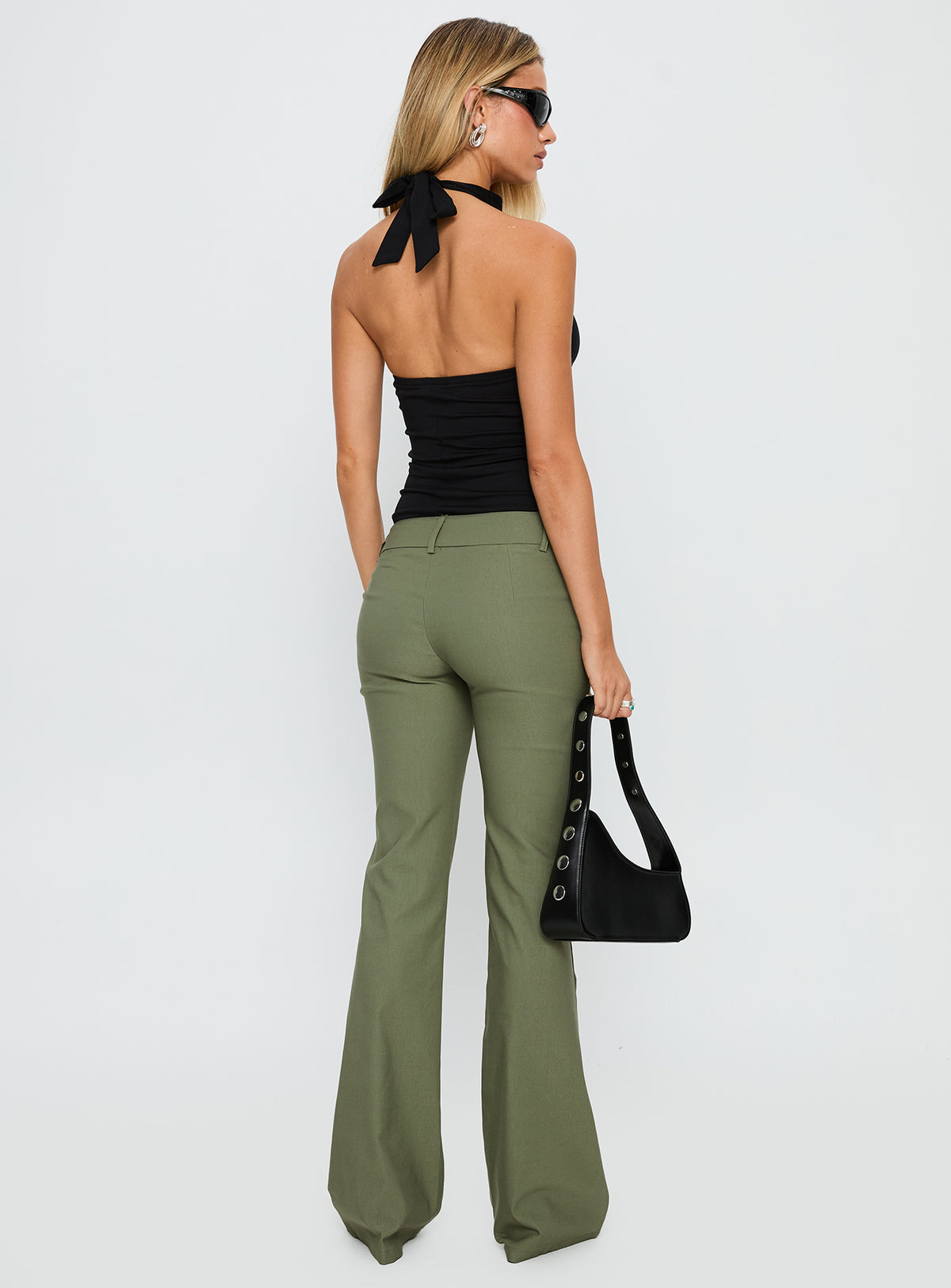 back view of model wearing Princess Polly Kinkirk Flared Pants Olive Green Low Rise Pants Pants 