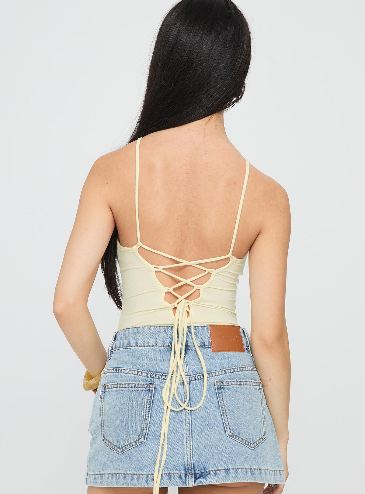 back view of model wearing Princess Polly Kianu Beaded Bodysuit Lemon Sleeveless Bodysuit 