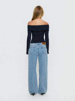 Displaying the Ellanor Low Rise Slouch Denim Jean Washed Mid Blue Wash Tall womens-jeans back view of model wearing Princess Polly