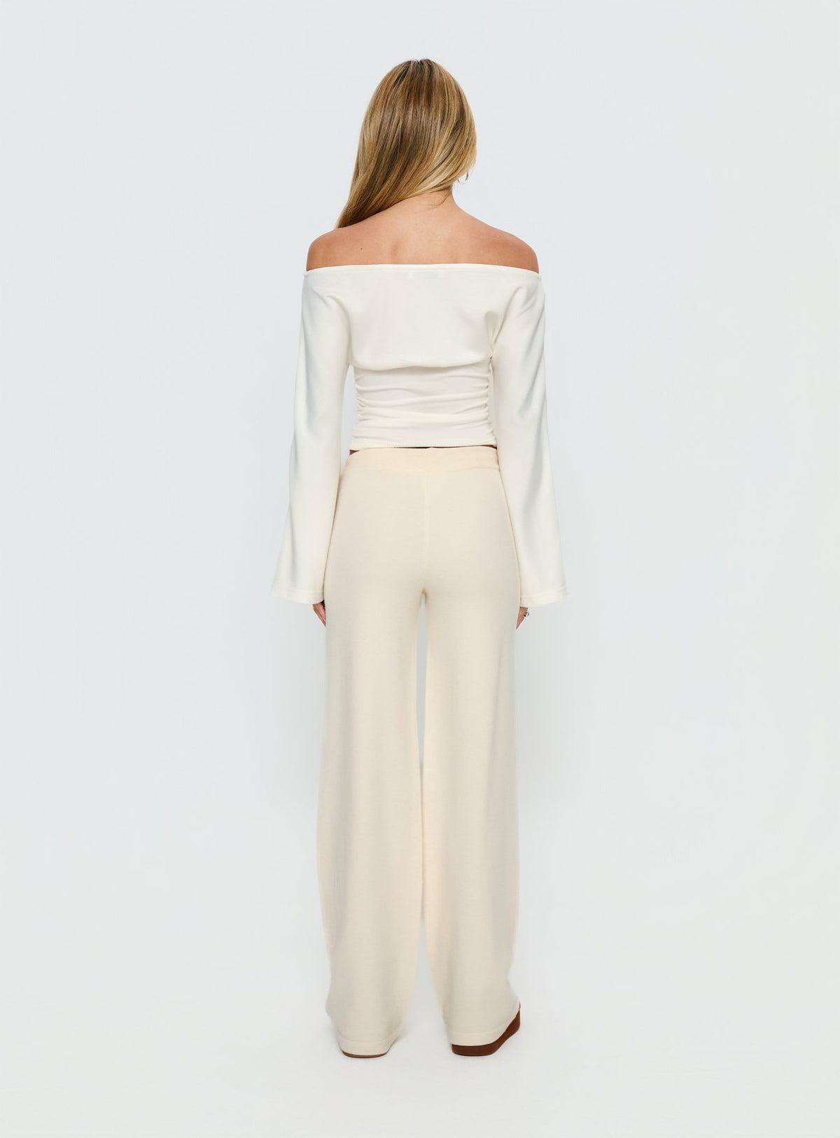 back view of model wearing Princess Polly Felisha Low Waist Knit Pants White Mid Rise Pants Pants 
