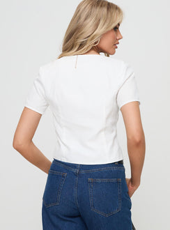 back view of model wearing Princess Polly Corriander Shirt White Short Sleeves V-Neck 