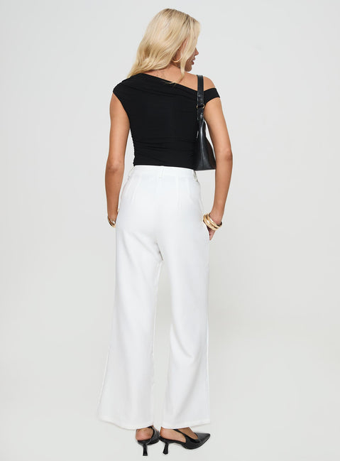 back view of model wearing Princess Polly Jazzar Pocket Detail Pleated Pant White Petite High Rise Pants Pants 